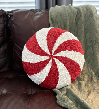 Close-up of the hand-hooked wool detailing of peppermint swirl pillow