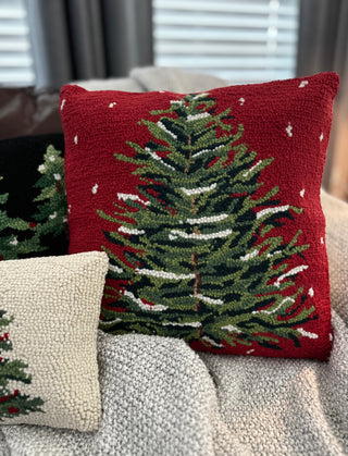 Wool texture and vibrant holiday-themed snow tree pillow close-up