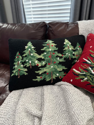 Detailed forest of Christmas trees on a soft, textured wool pillow—perfect for cozy winter decor.