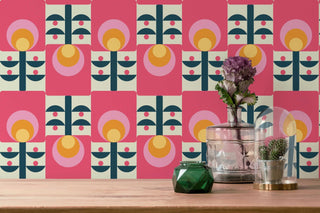 close up image of pink floral retro scandi drawer liner as wallpaper.